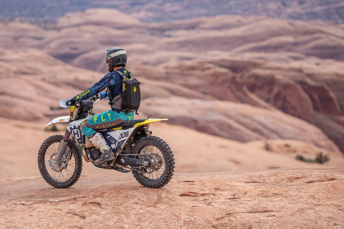 motocross rider in the moab slick rocks