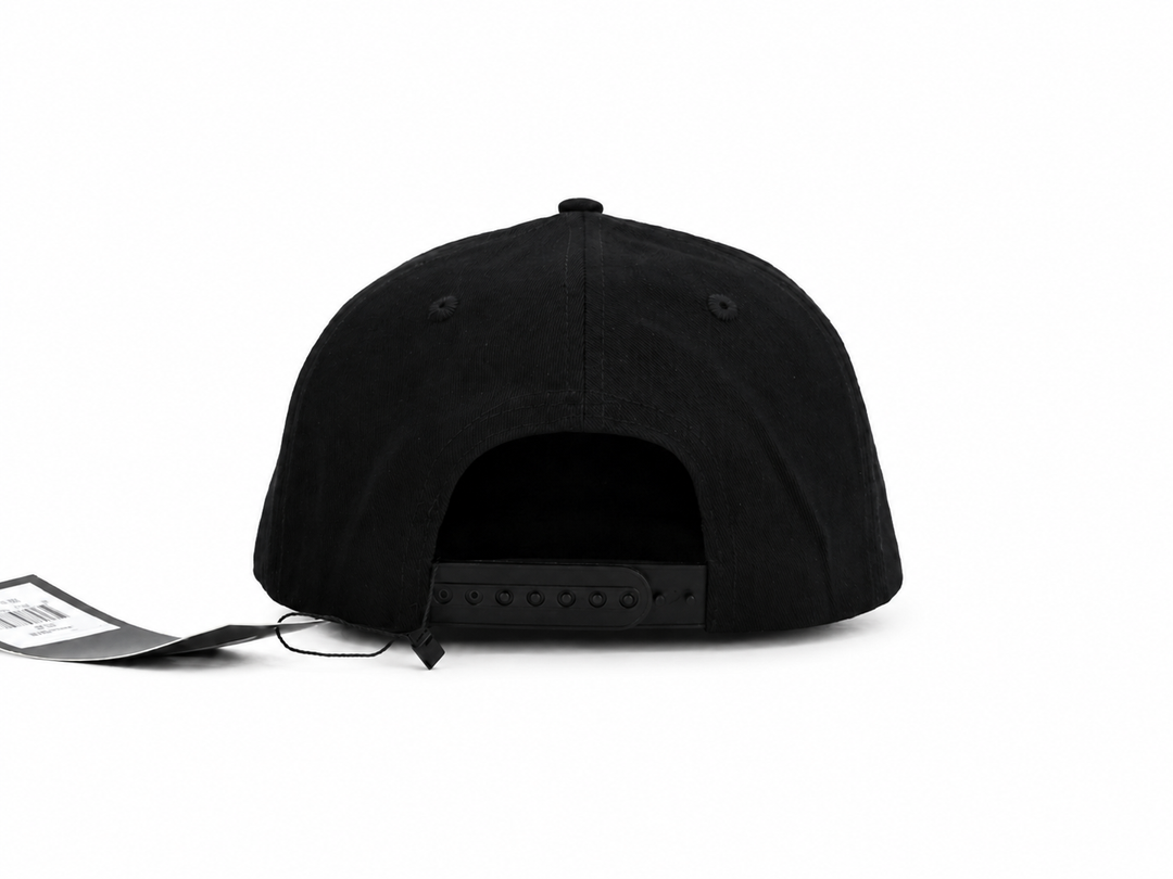 Black flat-brim snapback cap shown from the back, featuring a black adjustable strap and a black retail hangtag, on a solid white background.